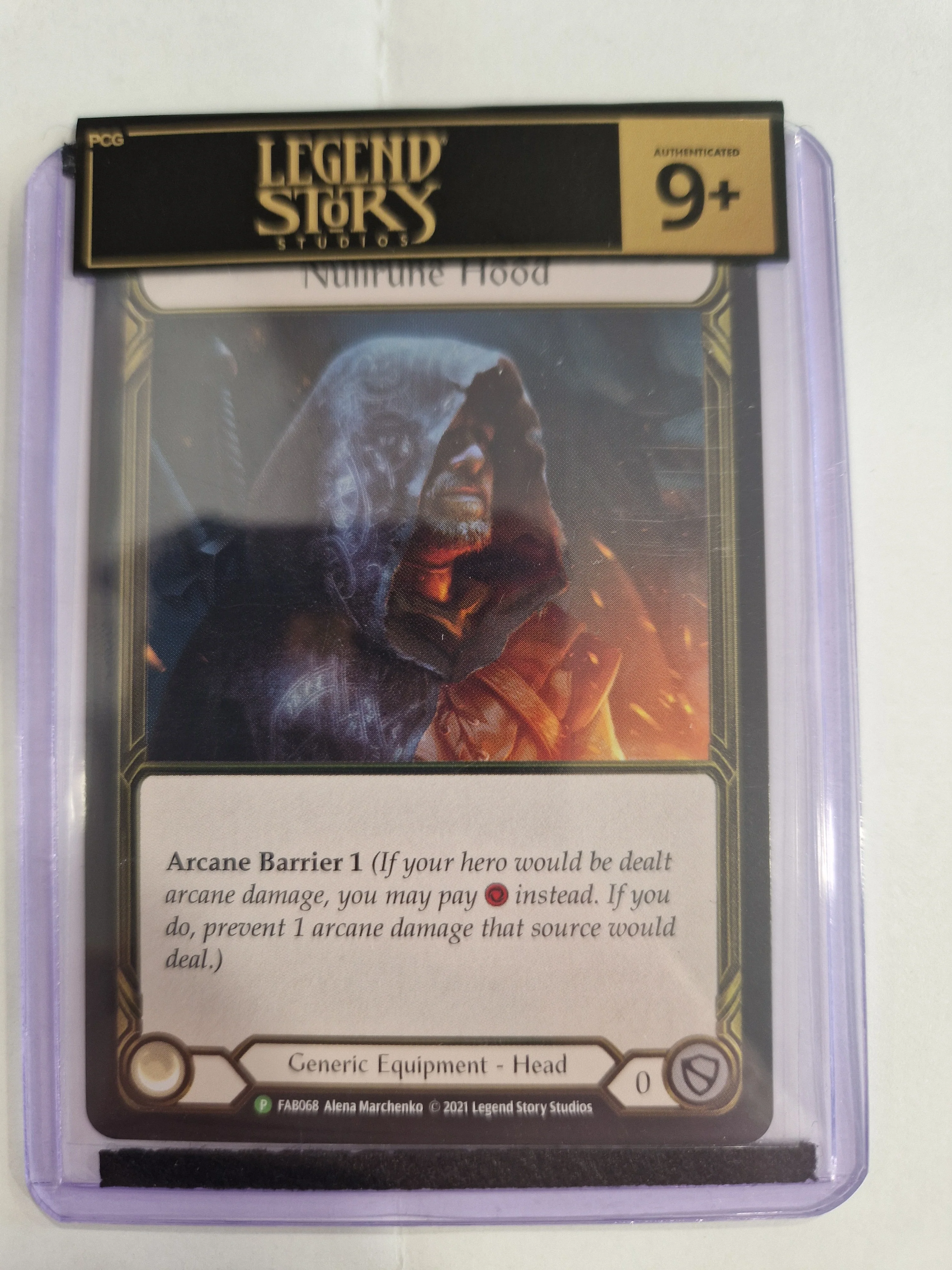 FAB Slab - Nullrune Hood Gold Cold Foil Toploader